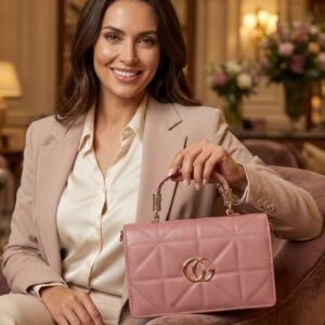 Elegant Pink Quilted Handbag with Gold Accent Logo & Top Handle